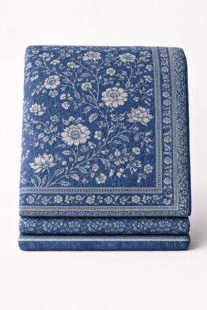 Jaipuri hand block printed cotton quilt with indigo blue base and ivory floral pattern