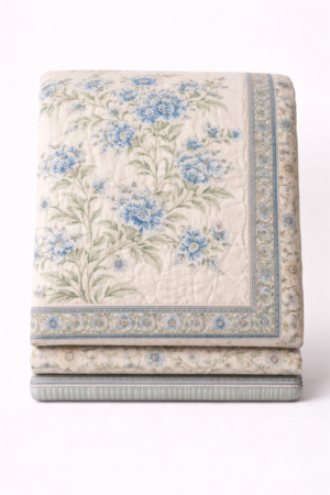 Jaipuri hand-painted cotton quilt with blue floral motifs created using natural organic colours